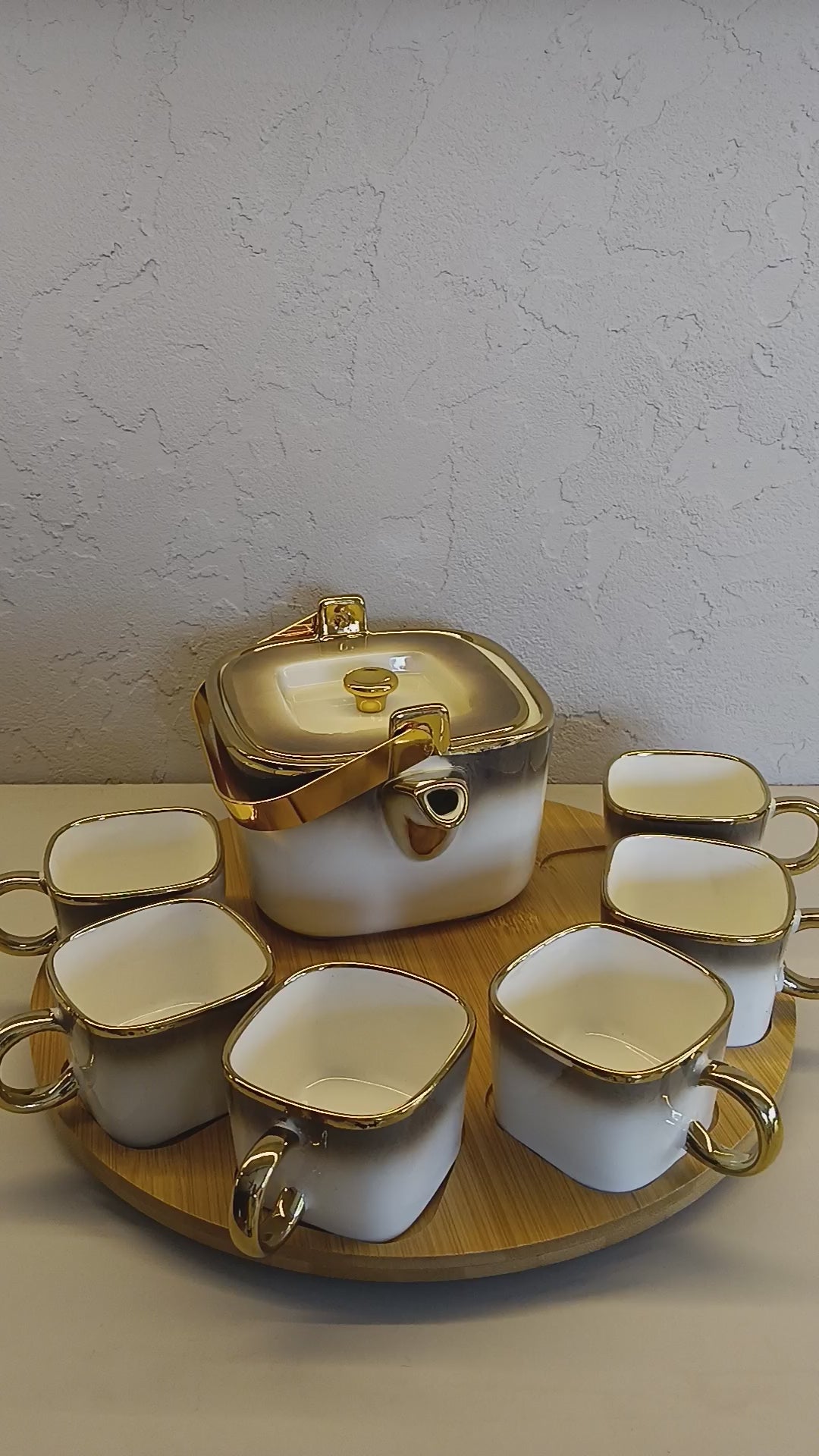 Luxurious Ceramic Tea/Coffee Set With Golden Detailing, Featuring A Teapot, And A Rotating Wooden Base Tray