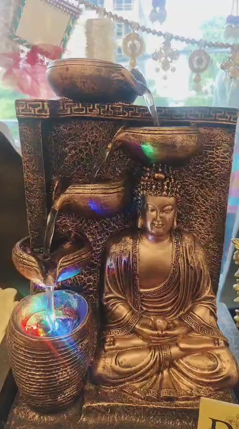 A Beautifully Designed Buddha Water Fountain Featuring A Meditating Buddha With Cascading Water Bowls